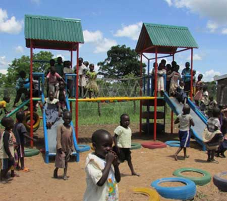 Ugandan nursery children on the Agwata School’s large playground structure built in early 2016 and still being enjoyed in 2020