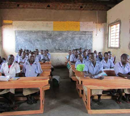 Fifth grade students happy with their new desks – July 2016